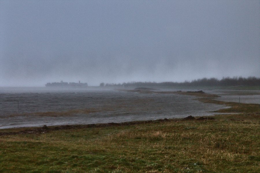 File:Hooksiel winter surge flood Felix with container ship.jpg